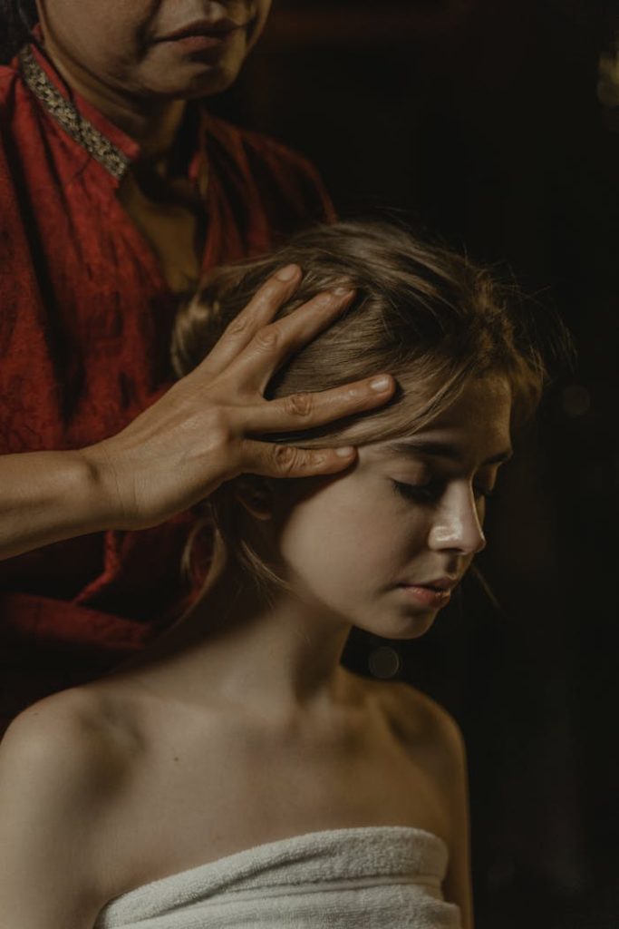 A soothing head massage promoting relaxation and wellness, captured in a peaceful setting.